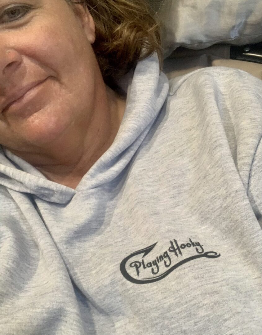Playing Hooky, LLC logo on the gray hoodie