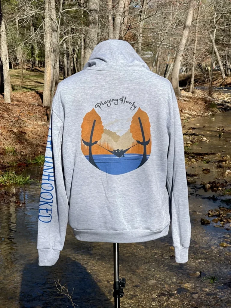 Gray hoodie backside view with playing hooky print on it